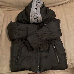 Calvin Klein Puffer boys jacket with hood. Gently used no rips/tears or stains.